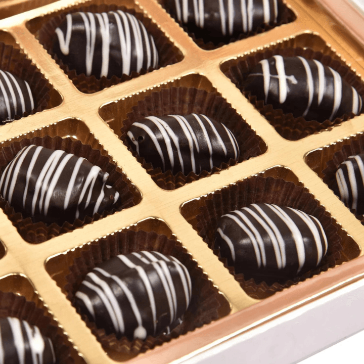 Hand-dipped Choco Fantasy dates in a gold tray